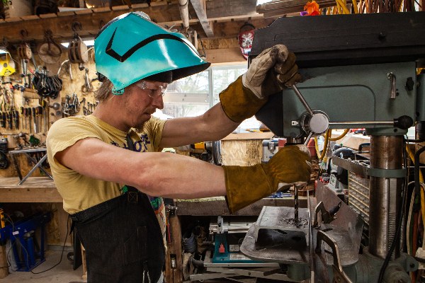 Skilled tradesman in work gear on an industrial job site